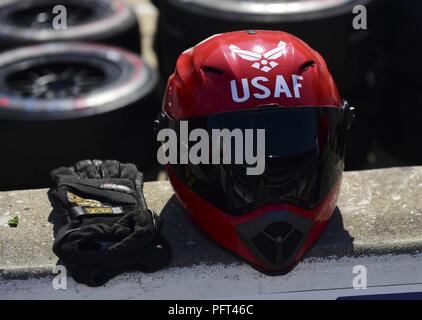 A pit crew member’s helmet sits atop a wall at the Indianapolis Motor Speedway in Indianapolis, Indiana, during the 2018 Indianapolis 500, May 27, 2018. Conor Daly, the driver of the No. 17 car was sponsored by the U.S. Air Force, sporting a USAF Thunderbirds paint scheme. This was the first time the Air Force has been a primary sponsor for the race. Stock Photo