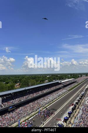 A B-2 Spirit flies over the Indianapolis Motor Speedway in Indianapolis, Indiana to signal the start of the 2018 Indianapolis 500, May 27, 2018. Flyovers educate current and future generations on the long-term importance of the U.S. Air Force by showcasing American airpower to positively affect recruiting and retention, while enhancing community relations. They also honor the sacrifices of those currently serving, as well as the sacrifices of war heroes of past. Stock Photo