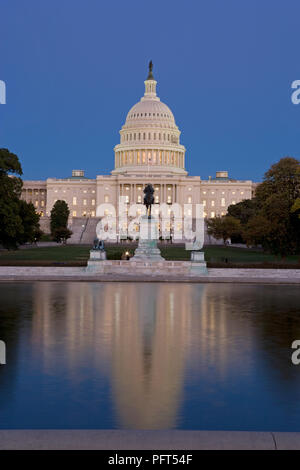 USA, Washington DC, US Capitol seen across reflecting pool, dusk Stock Photo