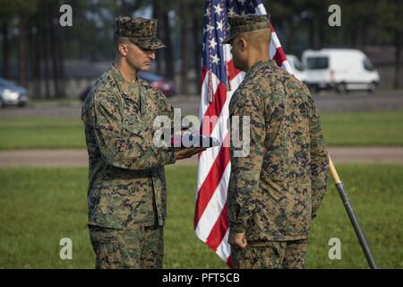 U.S. Marine Corps Col. Aaron Brunk, left, Joint Exercise Support Group ...