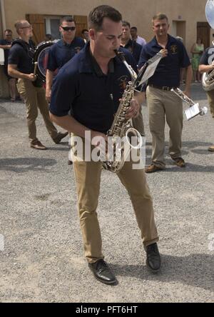 U.S. Marine Corps Sgt. Matthew Swigart with the 2d Marine Division Band, 2d MARDIV, plays his saxophone during a live performance at the 1775 Cafe de la place after the memorial ceremony of the Battle of Belleau Wood in Belleau, France on May 27, 2018. Sixth Marines is conducting bi-lateral training with the 6th Light Armored Brigade, in junction to honor the 100th anniversary of the Battle of Belleau Wood. Stock Photo