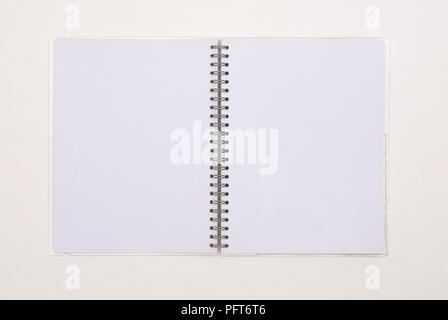 Opened spiral notebook with blank pages Stock Photo