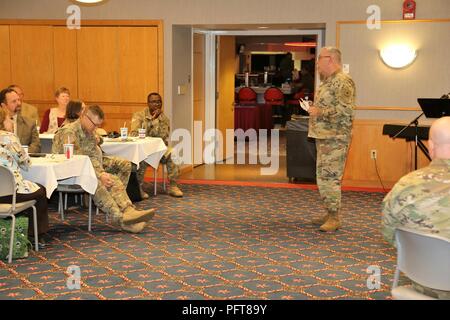 Chaplain (Brig. Gen.) Robert Pleczkowki, deputy chief of chaplains at the U.S. Army Reserve Office of the Chief of Chaplains in Washington, D.C., gives his presentation during the Memorial Day Prayer Luncheon on May 24, 2018, at Fort McCoy, Wis. The event was organized by the Fort McCoy Religious Support Office. The luncheon featured music, prayers, and Pleczkowki as guest speaker. Memorial Day is officially observed the last Monday in May and honors the men and women who have died during their military service. Stock Photo