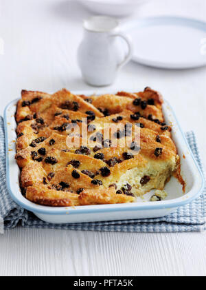 Bread and butter pudding with sultanas, in baking dish Stock Photo