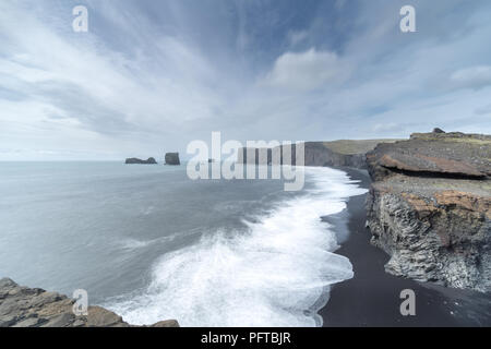 The dramatic ocean and cliff views of Dyrhólaey on the southern coast of Iceland, near the town of Vik. Stock Photo