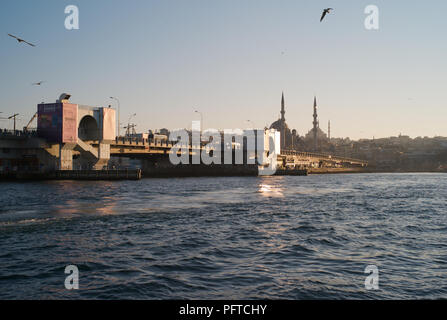 ISTANBUL, TURKEY - January 3 2012: Galata Bridge and Golden Horn, Yeni Mosque in the Background Stock Photo