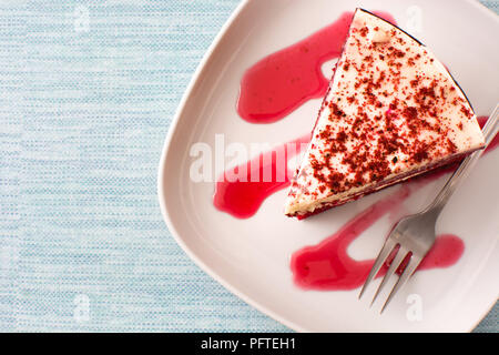 Red Velvet cake slice on blue background. Top view. Copyspace Stock Photo