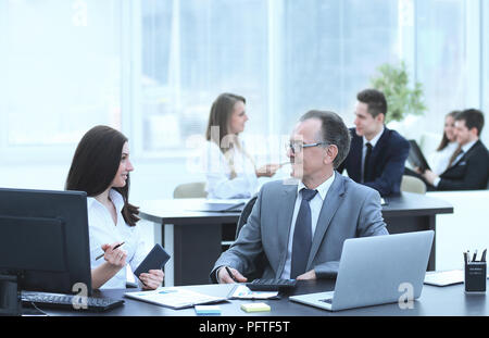 Businessman analyzing investment, budget and income charts at his workplace Stock Photo