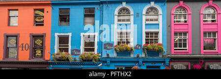 Colourful shop fronts on Victoria Terrace, Edinburgh, during the festival Stock Photo