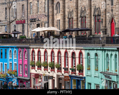 Colourful shop fronts on Victoria Terrace, Edinburgh, during the festival Stock Photo