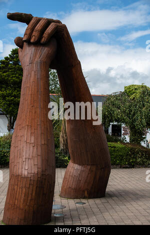 Gretna Green, United Kingdom - August 08 2018:   The Clasped hands statue by Ray Lonsdale, a representation of the maarriages that Gretna Green is fam Stock Photo