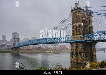 John A. Roebling Suspension Bridge, Cincinnati, Ohio on a foggy day. Stock Photo
