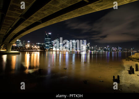 Long exposure view of Perth city across the Swan river taken from underneath the Narrows bridge Stock Photo