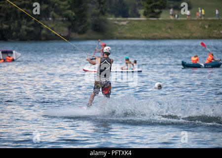 wake boarding with a cable on the lake Stock Photo