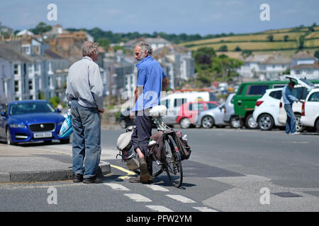 Two older men talking in Falmouth, Cornwall. Stock Photo
