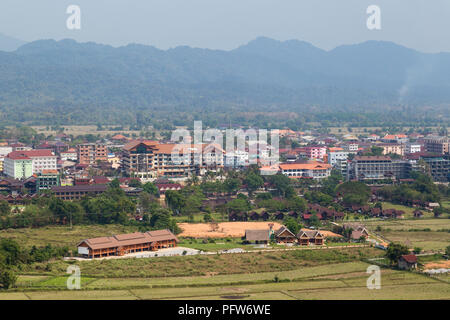 Hotels in downtown Vang Vieng viewed from above on a sunny day in Laos. Stock Photo