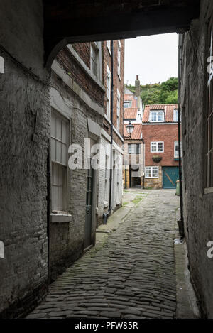 Narrow side street in the historic town of Whitby in North Yorkshire, England. Stock Photo