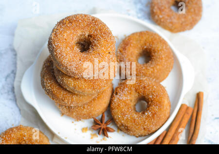 Cinnamon Donuts, Freshly Baked Homemade Doughnuts Covered in Sugar and Cinnamon Mixture Stock Photo
