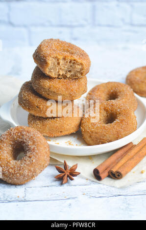 Cinnamon Donuts, Freshly Baked Homemade Doughnuts Covered in Sugar and Cinnamon Mixture Stock Photo
