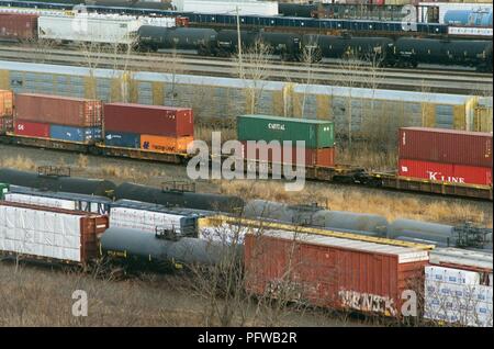 Aerial view, close-up of freight trains in a rail yard carrying tanker cars, intermodal shipping containers, and other cargo, March 18, 2018. () Stock Photo