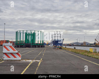 A view of one of the Quays at the Marine Terminal in Den Haag in Amsterdam, with Ships, Drums and other equipment visible. Holland. Stock Photo