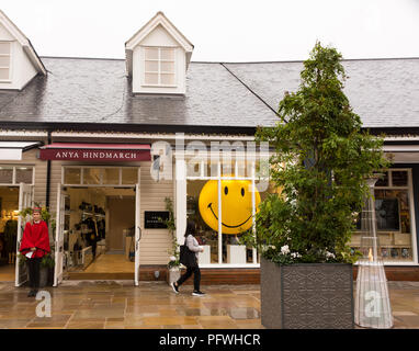 A wet shopping day at Bicester Village, Oxfordshire, UK Stock