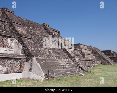 Three stony pyramids at famous Teotihuacan ruins landscape seen from Avenue of the Dead near Mexico city Stock Photo