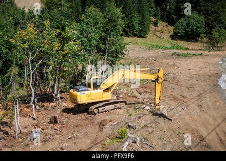 Photo of working excavator on summer day Stock Photo