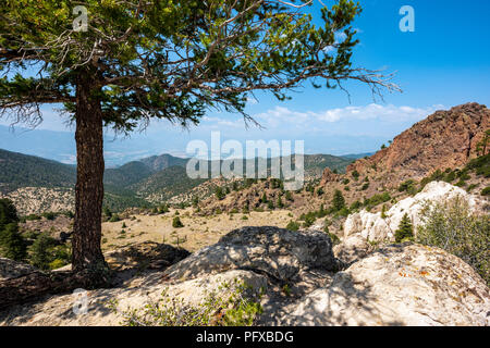 High vantage point view of forest fire smoke; town of Salida; Arkansas River Valley & Rocky Mountains beyond from The Crater; USA Stock Photo