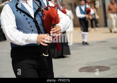 Man playing bagpipe, spanish traditional dance group Stock Photo