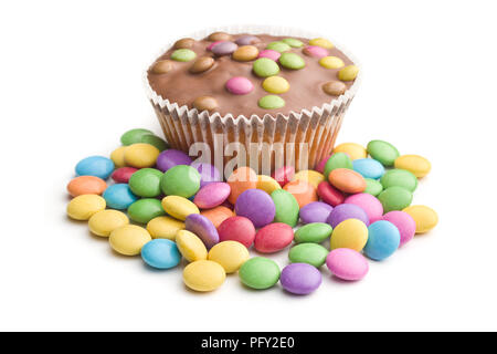 Sweet cupcakes with candies isolated on white background. Stock Photo