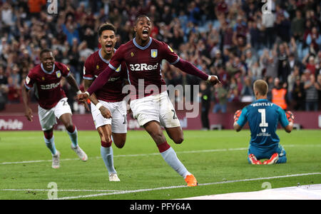 Aston Villa's Jonathan Kodjia (centre) celebrates scoring his side's second goal of the game as Brentford goalkeeper Daniel Bentley (right) looks dejected during the Sky Bet Championship match at Villa Park, Birmingham. Stock Photo