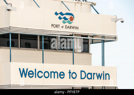 Darwin, Northen Territory, Australia - December 1, 2009: Welcome sign with logo to the Port of Darwin on white Terminal building. Gray sky. Stock Photo