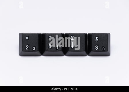 black keys of keyboard with different years words or names Stock Photo
