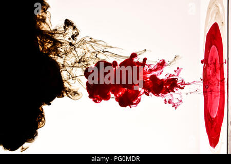 Ink drops in water with white background Stock Photo