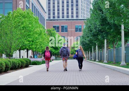 Chicago, Illinois, USA. Students walking on the campus of Loyola Univeristy. The Ctaholic Jesuit university is located on Chicago's far North Side. Stock Photo