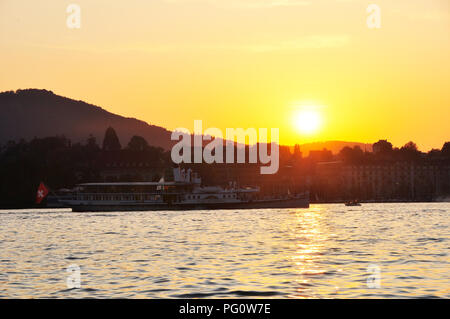 Zürich-City: Sunset cruise on Lake Zürich with one of the two steam-ships arriving at Enge Stock Photo