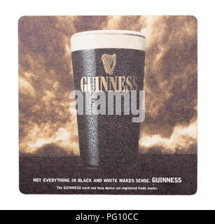 LONDON, UK - AUGUST 22, 2018: Guinness paper beer beermat coaster isolated on white background. Stock Photo