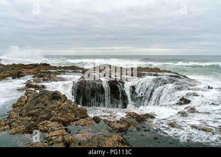 The Thor's Well on the rocky basaltic headlands of Cape Perpetua Scenic Area, Yachats, Oregon Coast, US route 101, USA. Stock Photo