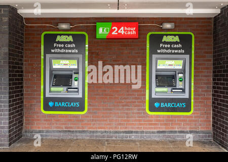 Cash machines at Asda supermarket, operated by Barclays bank in Crewe Cheshire UK Stock Photo