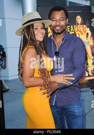 Los Angeles, CA, USA. 22nd Aug, 2018. Sugar Shane Mosley, Trista Pisani at arrivals for SUPPORT THE GIRLS Premiere, ArcLight Hollywood, Los Angeles, CA August 22, 2018. Credit: Elizabeth Goodenough/Everett Collection/Alamy Live News Stock Photo