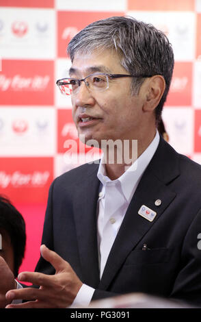 Tokyo, Japan. 23rd Aug, 2018. Japan Airlines (JAL) president Yuji Akasaka announces the business strategy for 2020 at a JAL hangar of the Haneda airport in Tokyo on Thursday, August 23, 2018. JAL will invest 10 billion yen to improve airport facilities and will change their uniforms in 2020. Credit: Yoshio Tsunoda/AFLO/Alamy Live News Stock Photo