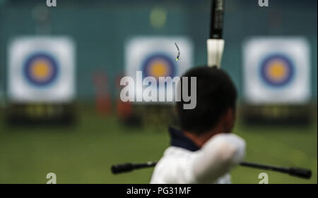 Jakarta, Indonesia. 23rd Aug, 2018. Lee Wooseok of South Korea competes during the Recurve Men's Individual 1/16 Eliminations of Archery at the 18th Asian Games in Jakarta, Indonesia, Aug. 23, 2018. Stock Photo