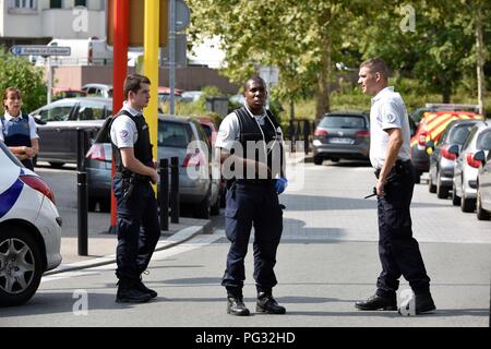 Paris, France. 23rd Aug, 2018. Policemen stand on guard at the scene of an attack, in Paris suburbs, France, on Aug. 23, 2018. One person was killed and two others wounded in a knife attack on Thursday in Paris suburbs, local media cited police as saying. Credit: Chen Yichen/Xinhua/Alamy Live News Stock Photo