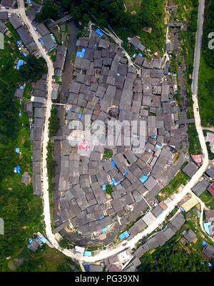 Congjiang, Congjiang, China. 24th Aug, 2018. Congjiang, CHINA-Local villagers air the harvested red pepper at Zengchong Dong Village in Congjiang, southwest China's Guizhou Province. Credit: SIPA Asia/ZUMA Wire/Alamy Live News Stock Photo