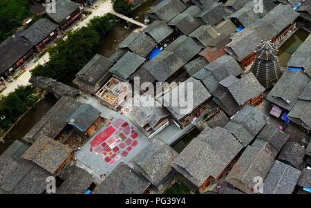 Congjiang, Congjiang, China. 24th Aug, 2018. Congjiang, CHINA-Local villagers air the harvested red pepper at Zengchong Dong Village in Congjiang, southwest China's Guizhou Province. Credit: SIPA Asia/ZUMA Wire/Alamy Live News Stock Photo