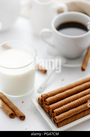 Still life with wafer rolls and milk Stock Photo