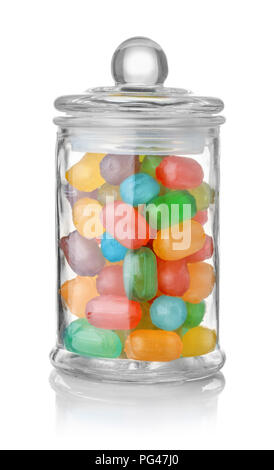 Glass jar full of colorful hard candies isolated on white Stock Photo