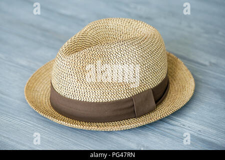 Vintage straw hat fashion for man, against a background of gray wooden boards Stock Photo