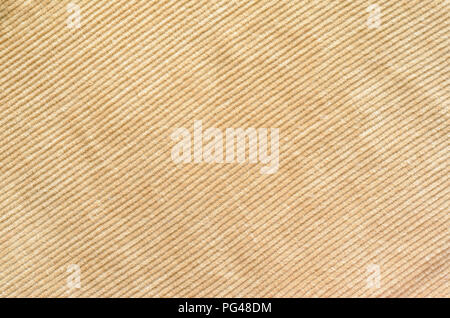 Texture of Beige Velvet Clothes. Textile Fabric of Corduroy as Background Stock Photo